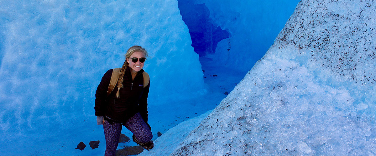 Student in front of a glacier