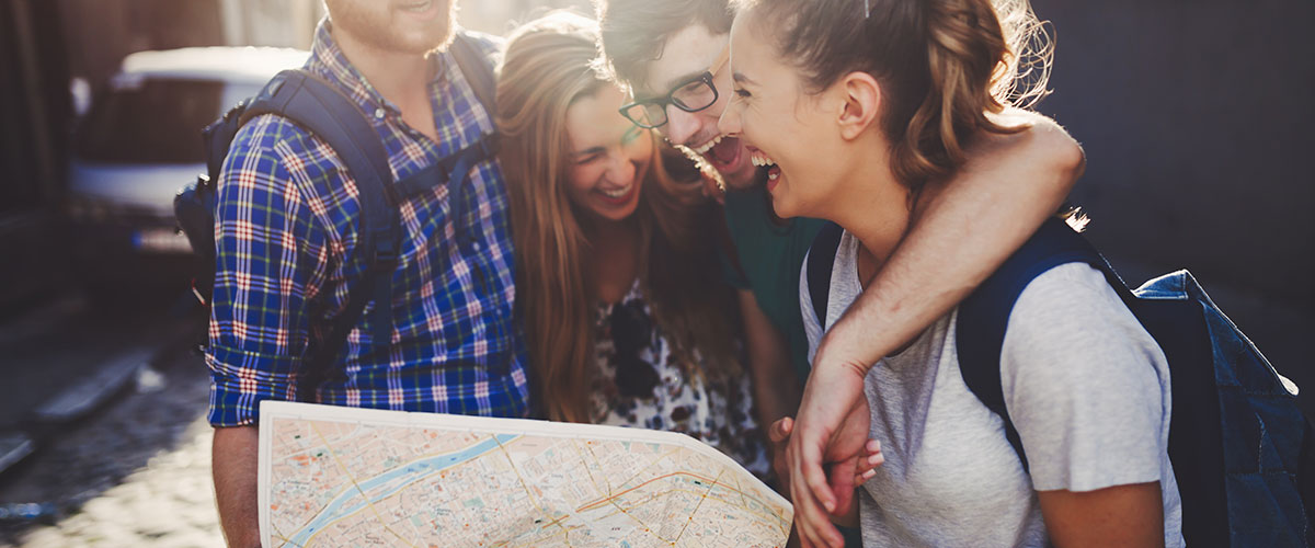 study abroad students using a map to navigate